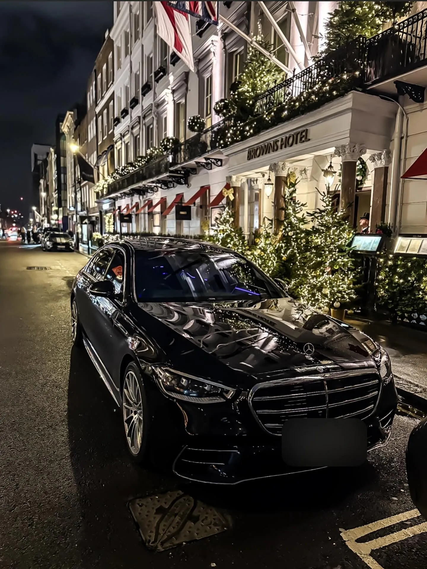 Black Mercedes S-Class outside Brown's Hotel in London at night